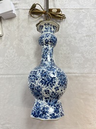 A pair of blue and white Dutch Delft garlic-head vases mounted as lamps, 18th C.