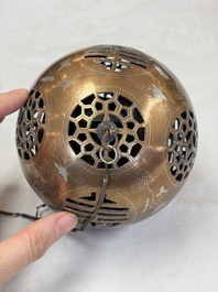 A Chinese or Vietnamese silver-inlaid copper reticulated spherical censer and a silver- and copper-inlaid bronze tripod censer, 19th C.