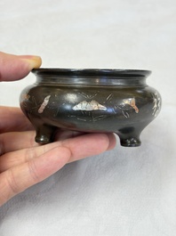 A Chinese or Vietnamese silver-inlaid copper reticulated spherical censer and a silver- and copper-inlaid bronze tripod censer, 19th C.