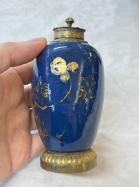 A Chinese powder-blue-ground gilt-decorated spittoon and two gilt-bronze-mounted vases, 18th C.
