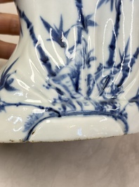 A Chinese blue and white 'Guanyin and child' group, Qianlong