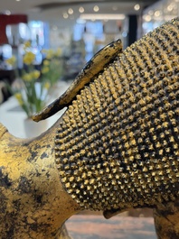 An exceptional and large Thai gilt-bronze figure of Buddha in Parinirvana, 18th C.