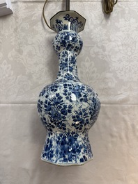 A pair of blue and white Dutch Delft garlic-head vases mounted as lamps, 18th C.