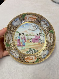 A pair of Chinese Canton famille rose cups and saucers with figural design, Daoguang