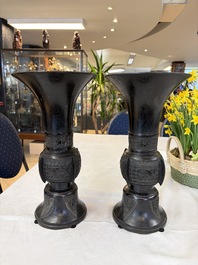 A pair of Chinese archaistic bronze 'Gu' vases, 18th C.