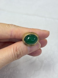 A pair of 18kt yellow gold cufflinks with green cabochon stones, 20th C.