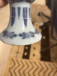 An extremely rare blue, white and manganese Dutch Delft chinoiserie beaker vase after a silver model, late 17th C.