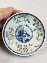 Three Chinese enamelled blue and white covered bowls on stands and a famille rose vase, Kangxi and Tongzhi mark, 19/20th C.