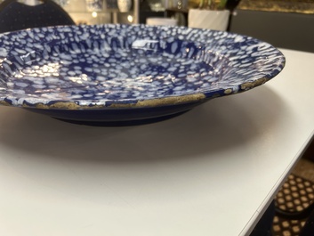 A rare large Nevers white-splashed blue-ground '&agrave; la bougie' dish, France, late 17th C.