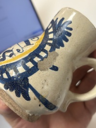 A very rare polychrome Antwerp maiolica 'IHS' jug, 16th C.
