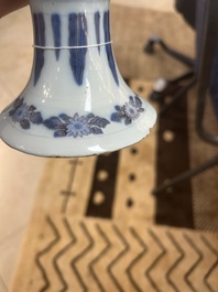 An extremely rare blue, white and manganese Dutch Delft chinoiserie beaker vase after a silver model, late 17th C.