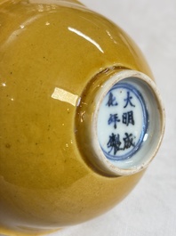 A pair of Chinese polychrome lions, a celadon-glazed goat, a yellow-glazed bowl and a sancai-glazed conical bowl, Chenghua mark, 19/20th C.