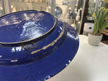 A rare large Nevers white-splashed blue-ground '&agrave; la bougie' dish, France, late 17th C.
