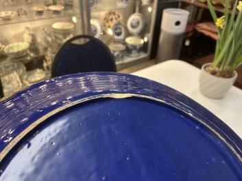 A rare large Nevers white-splashed blue-ground '&agrave; la bougie' dish, France, late 17th C.
