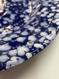 A rare large Nevers white-splashed blue-ground '&agrave; la bougie' dish, France, late 17th C.