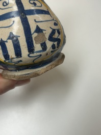 A very rare polychrome Antwerp maiolica 'IHS' jug, 16th C.