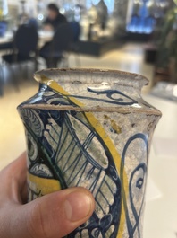 A polychrome Italian maiolica 'a trofei' albarello, inscribed V. APOSTL, Deruta, late 16th C.