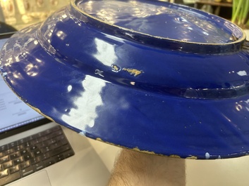 A rare large Nevers white-splashed blue-ground '&agrave; la bougie' dish, France, late 17th C.