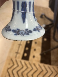 An extremely rare blue, white and manganese Dutch Delft chinoiserie beaker vase after a silver model, late 17th C.