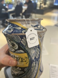 A polychrome Italian maiolica 'a trofei' albarello, inscribed V. APOSTL, Deruta, late 16th C.