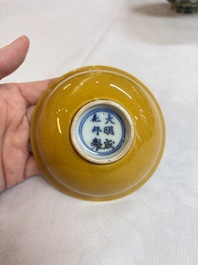 A pair of Chinese polychrome lions, a celadon-glazed goat, a yellow-glazed bowl and a sancai-glazed conical bowl, Chenghua mark, 19/20th C.