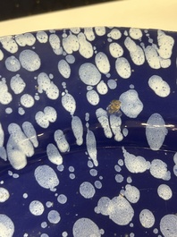 A rare large Nevers white-splashed blue-ground '&agrave; la bougie' dish, France, late 17th C.