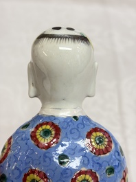 Six Chinese famille rose figures, one with a 'Lotus Throne' stand, 19th C.
