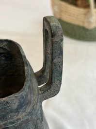 An inscribed Chinese archaic bronze food vessel and cover with double-dragon design, 'Yu Fang Ding 圉方鼎', Western Zhou