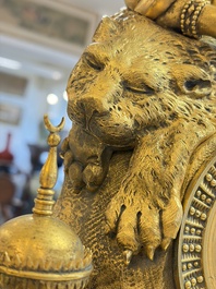 A gilt-bronze 'Oriental Beauty Reclining on a Lion Skin' mantel clock, France, first quarter 19th C.