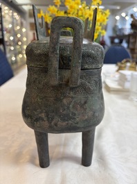 An inscribed Chinese archaic bronze food vessel and cover with double-dragon design, 'Yu Fang Ding 圉方鼎', Western Zhou