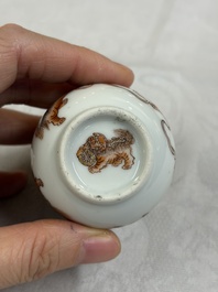 A Chinese gilt-decorated iron-red 'Buddhist Lions' snuff bottle with a red coral stopper, Buddhist Lion mark, Republic
