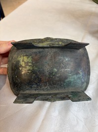 An inscribed Chinese archaic bronze food vessel and cover with double-dragon design, 'Yu Fang Ding 圉方鼎', Western Zhou