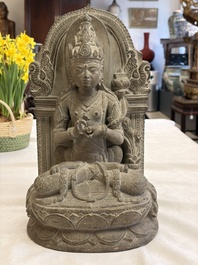 A Javanese carved stone figure of Prajnaparamita, 20th C.
