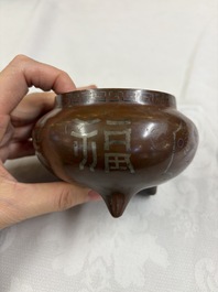A Chinese or Vietnamese silver-inlaid bronze 'Fu Lu Shou' tripod censer,  Xuande mark, 19th C.