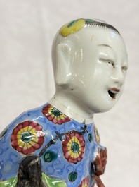 Six Chinese famille rose figures, one with a 'Lotus Throne' stand, 19th C.