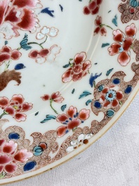 Eight Chinese famille rose plates with floral design and a 'Rooster' teapot, Yongzheng/Qianlong