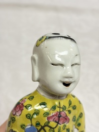 Six Chinese famille rose figures, one with a 'Lotus Throne' stand, 19th C.