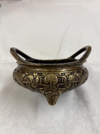 A Chinese bronze tripod 'Dragon' censer with two handles, Xuande mark, 19th C.