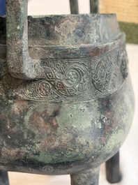 An inscribed Chinese archaic bronze food vessel and cover with double-dragon design, 'Yu Fang Ding 圉方鼎', Western Zhou