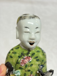 Six Chinese famille rose figures, one with a 'Lotus Throne' stand, 19th C.