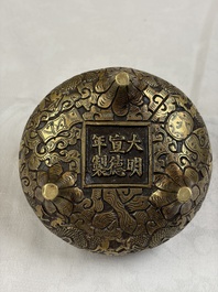 A Chinese bronze tripod 'Dragon' censer with two handles, Xuande mark, 19th C.