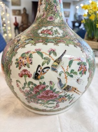 A Chinese Canton famille rose covered bottle vase and a teapot, 19th C.