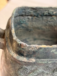 An inscribed Chinese archaic bronze food vessel and cover with double-dragon design, 'Yu Fang Ding 圉方鼎', Western Zhou