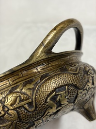 A Chinese bronze tripod 'Dragon' censer with two handles, Xuande mark, 19th C.