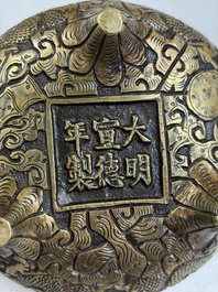 A Chinese bronze tripod 'Dragon' censer with two handles, Xuande mark, 19th C.