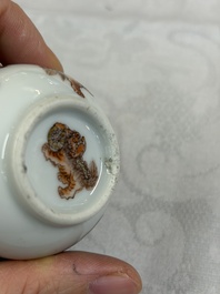 A Chinese gilt-decorated iron-red 'Buddhist Lions' snuff bottle with a red coral stopper, Buddhist Lion mark, Republic