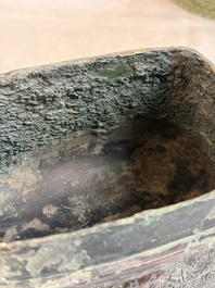 An inscribed Chinese archaic bronze food vessel and cover with double-dragon design, 'Yu Fang Ding 圉方鼎', Western Zhou