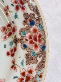 Eight Chinese famille rose plates with floral design and a 'Rooster' teapot, Yongzheng/Qianlong