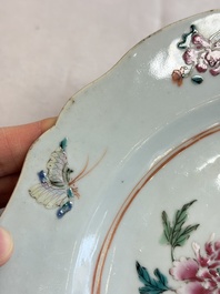 Eight Chinese famille rose plates with floral design and a 'Rooster' teapot, Yongzheng/Qianlong