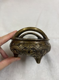 A Chinese bronze tripod 'Dragon' censer with two handles, Xuande mark, 19th C.